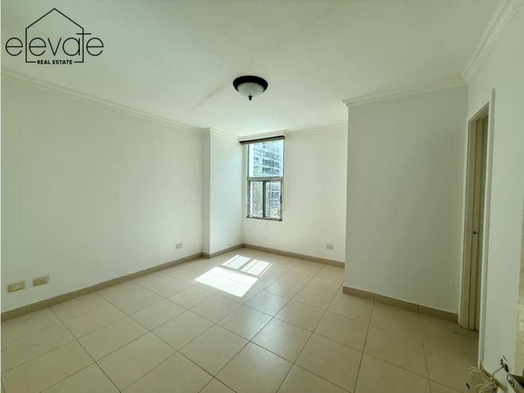 Kitchen with granite countertops, gas stove, large windows in PH Tao Tower Panama City apartment for sale