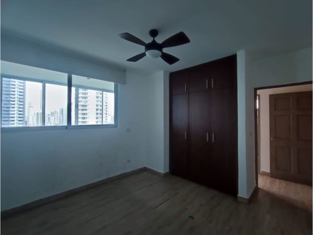 Secondary bedroom features built-in wardrobe and large window in PH Harmony in San Francisco Panama