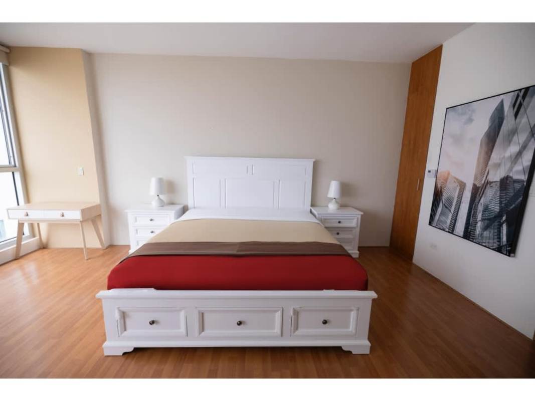 Modern minimalist bedroom with large window and white decor PH Ocean Club Punta Pacifica
