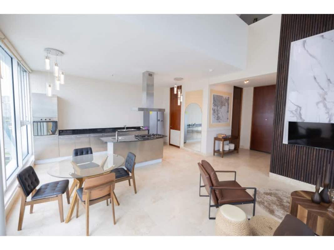 Modern open living dining area kitchen with marble backsplash PH Ocean Club Punta Pacifica Panama
