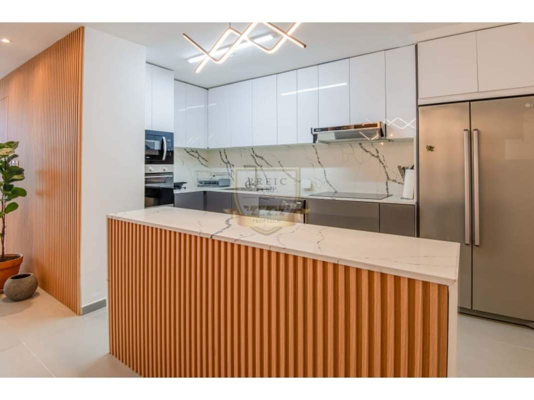 Renovated kitchen with marble countertops and built-in appliances in PH Yacht Club Avenida Balboa Panama