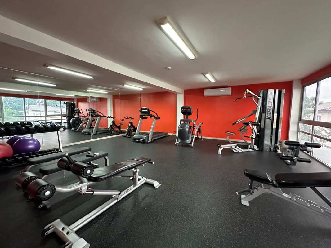 Large outdoor swimming pool with Jacuzzi in gated Costa Sur residential community Panama City