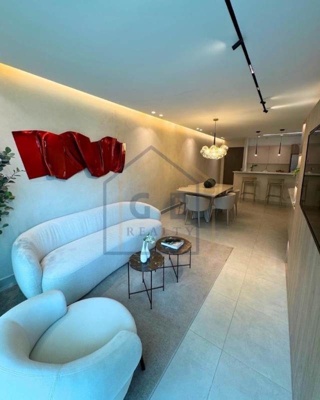 Open kitchen with quartz countertops and breakfast bar at Condado Gardens Panama