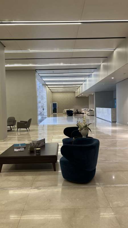 Furnished living dining room with large windows PH Lumiere Costa del Este Panama City apartment for rent