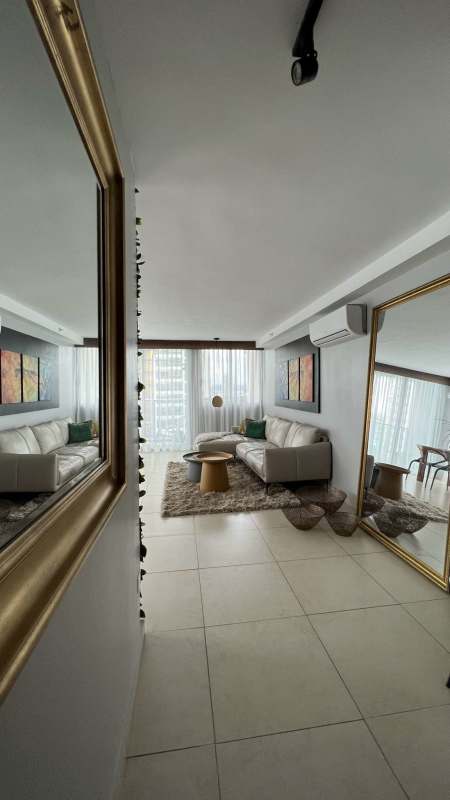 Covered seating terrace beside pool PH Lumiere Costa del Este Panama luxury rental