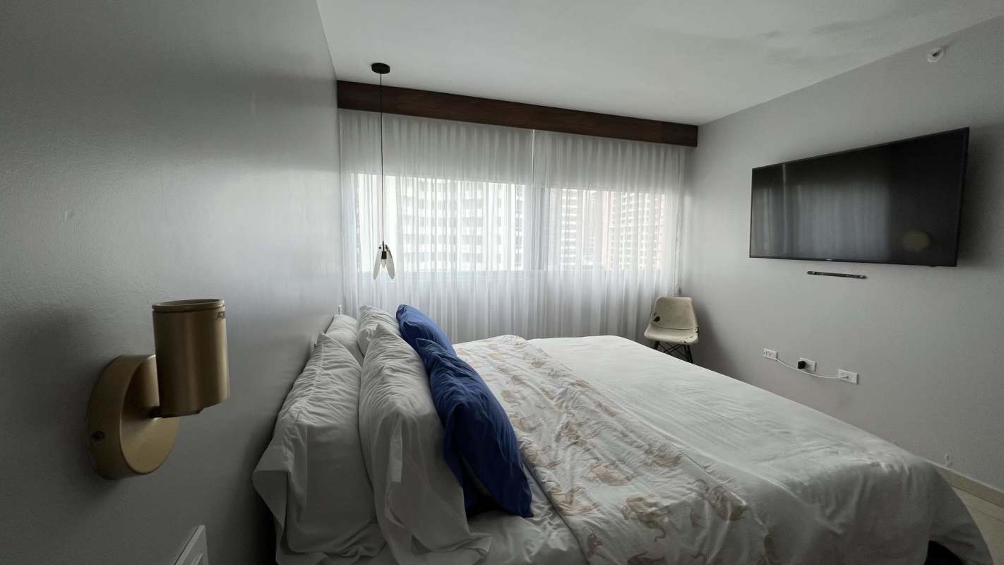 Furnished guest bedroom with window and AC PH Lumiere Costa del Este Panama rental apartment