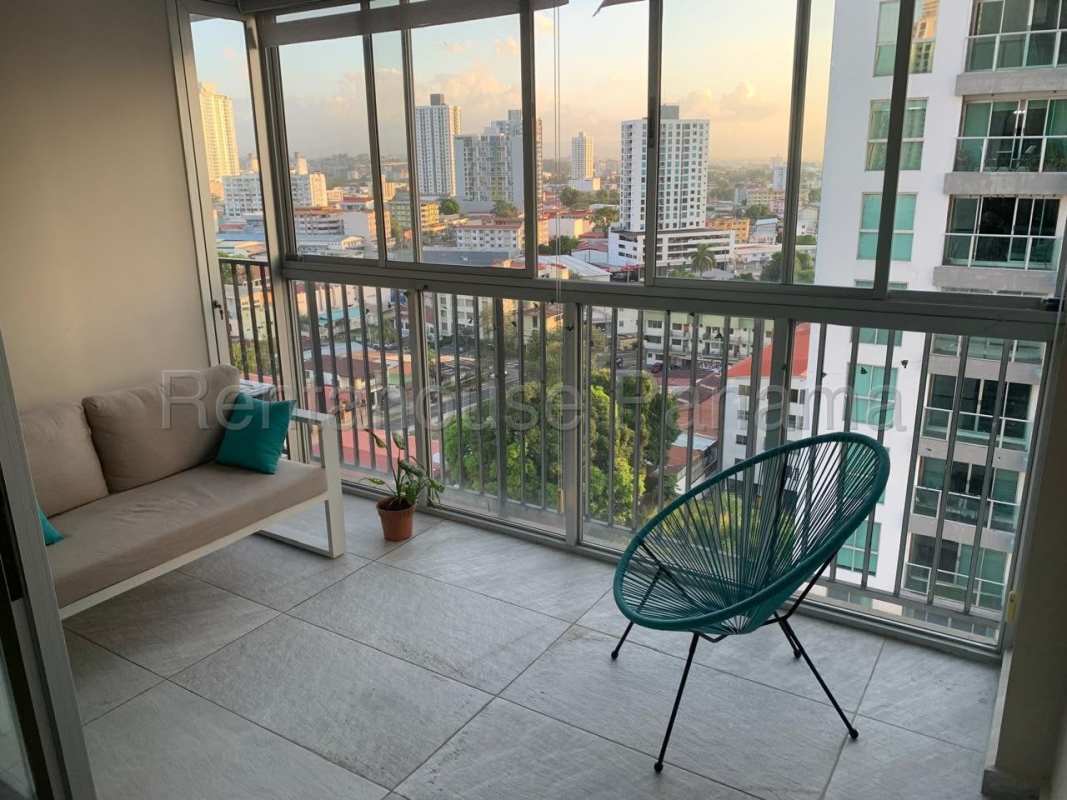 Open concept living room with porcelain flooring and balcony in Altos del Golf Panama