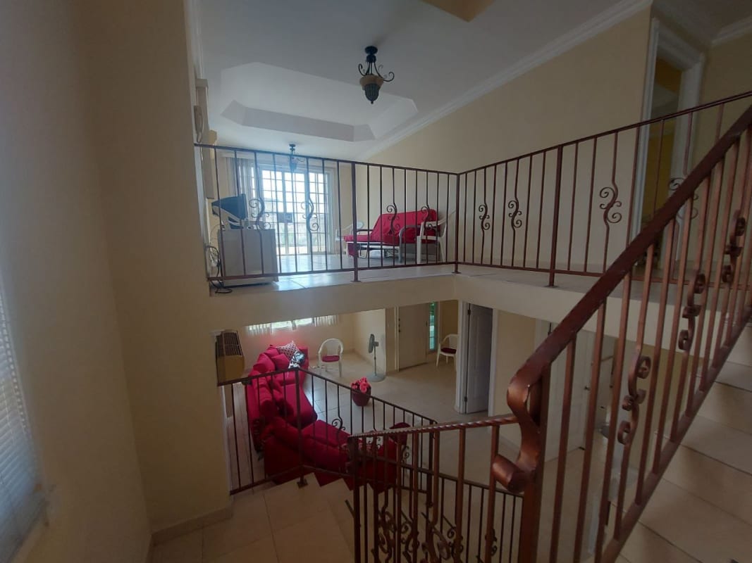 Covered outdoor patio with ceiling fans, tile flooring, garden area in Golden Springs Condado del Rey