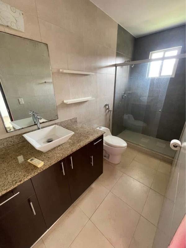 Contemporary bathroom with granite countertop, vessel sink and glass shower in Panama house for sale