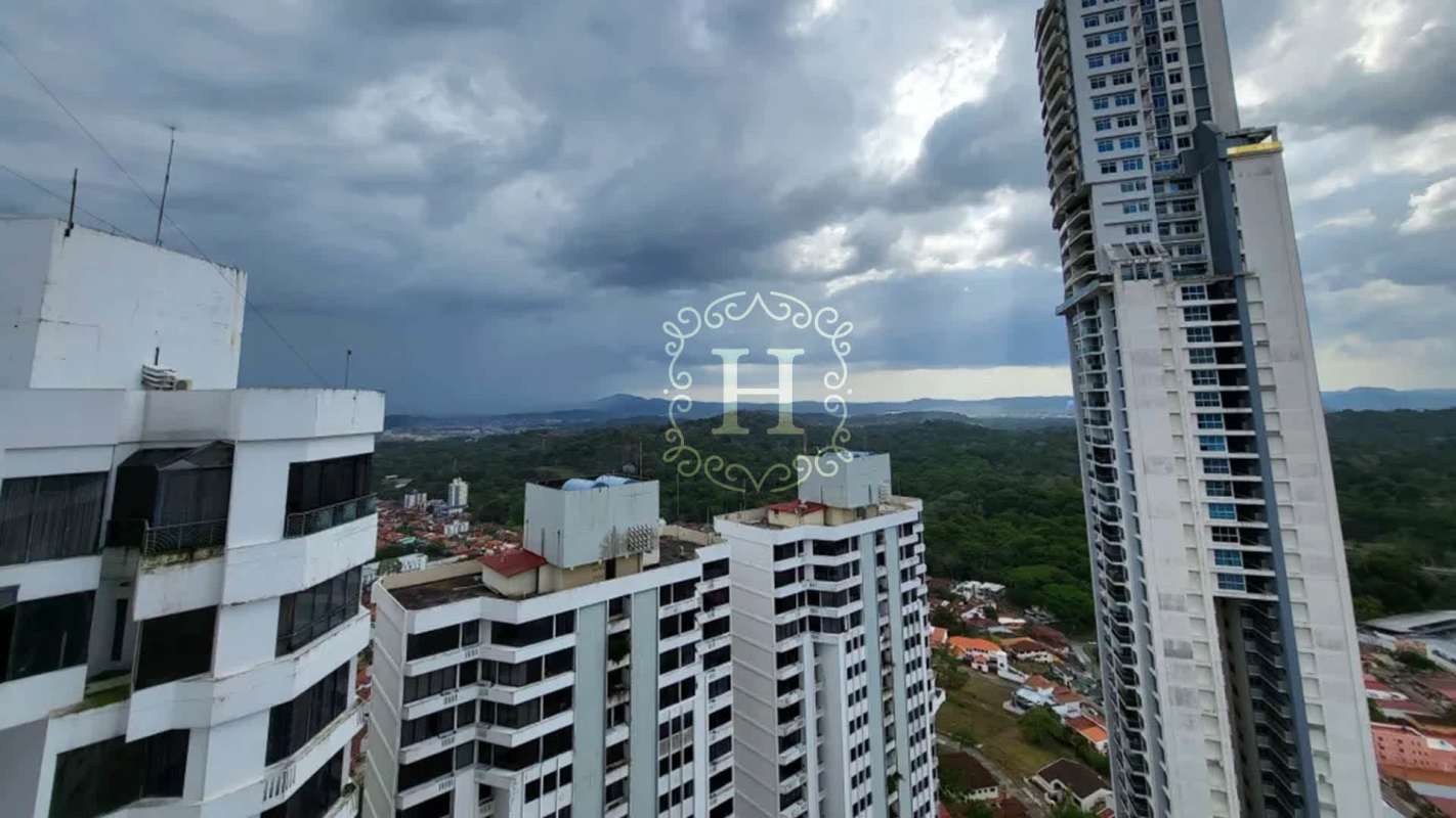 Aerial view of PH Dos Mares residential tower and Betania neighborhood with city landscape