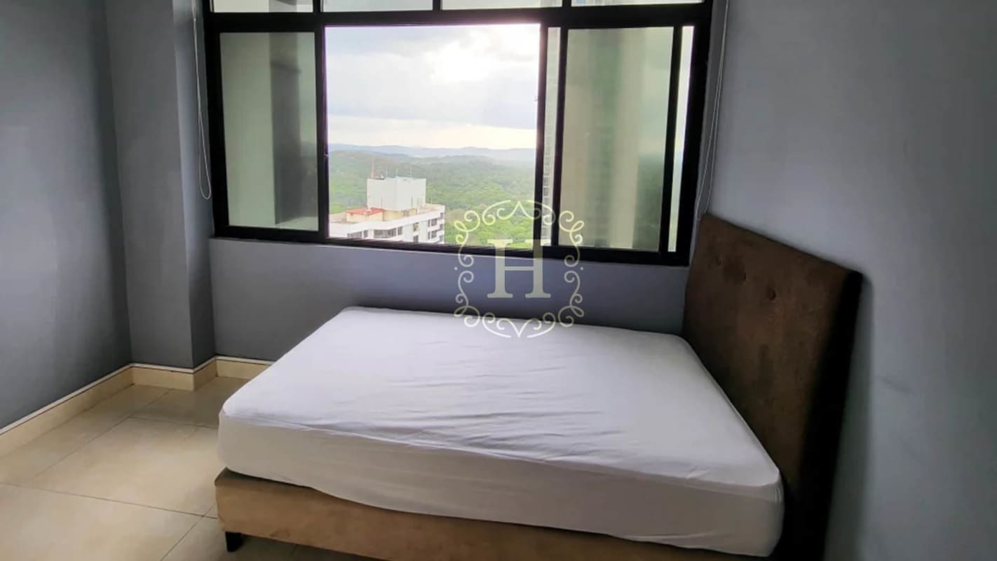 Bedroom with upholstered headboard, large window Panama Canal and city view PH Dos Mares