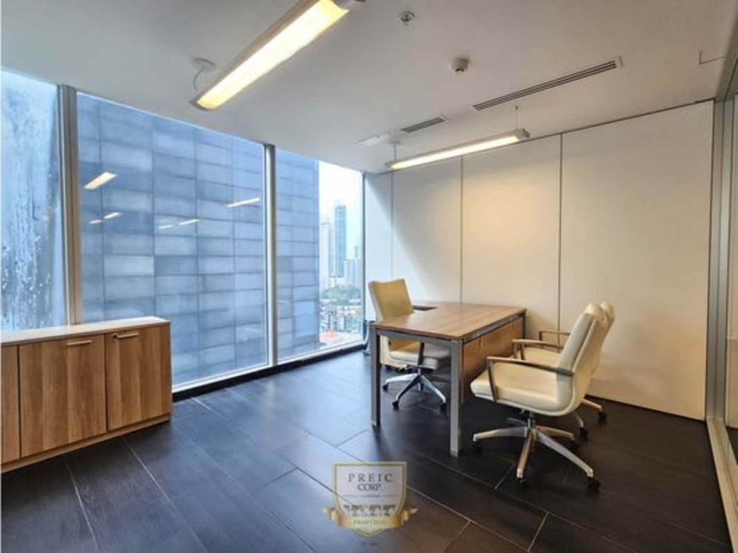 Modern office interior with large windows overlooking Punta Pacifica skyline in Oceania Business Plaza