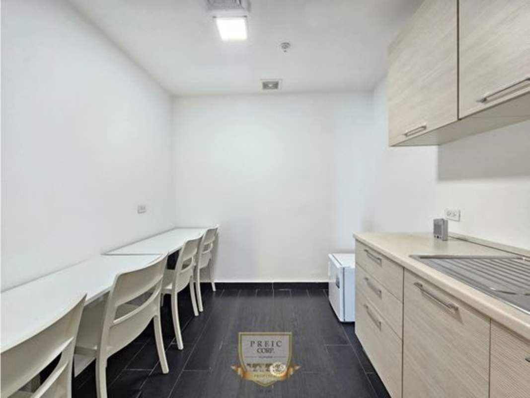 Minimalist kitchenette with seating, cabinetry, sink at Oceania Business Center Panama