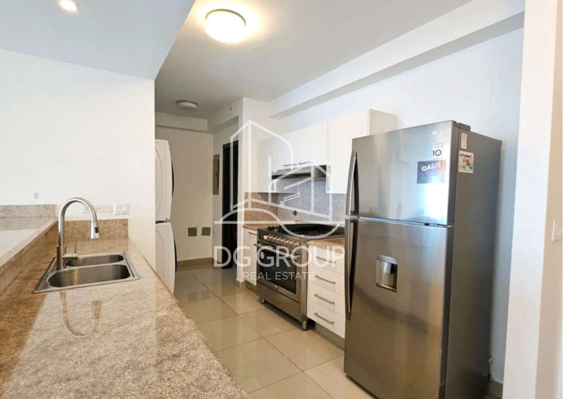 Contemporary kitchen with granite finishing and full appliances at Costa del Este apartment for rent