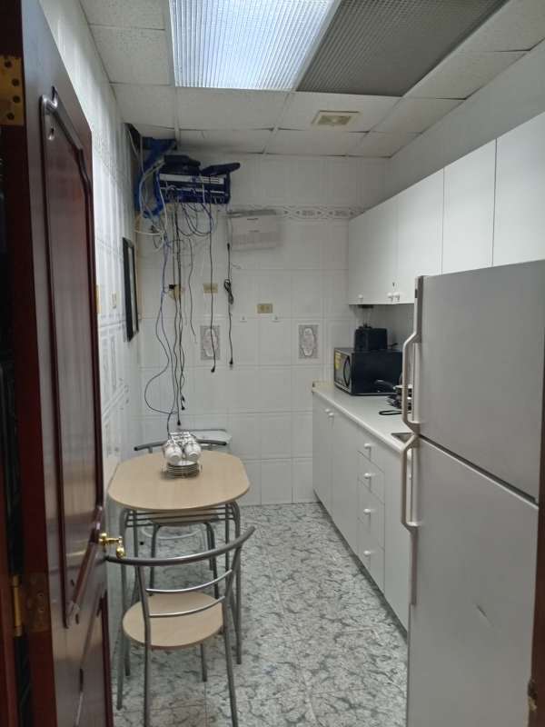 Private corporate office with large scenic windows and wooden desk at PH BICSA Tower Panama City