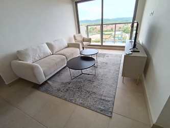 Modern kitchen with stainless appliances in PH Parterre Panama Pacifico