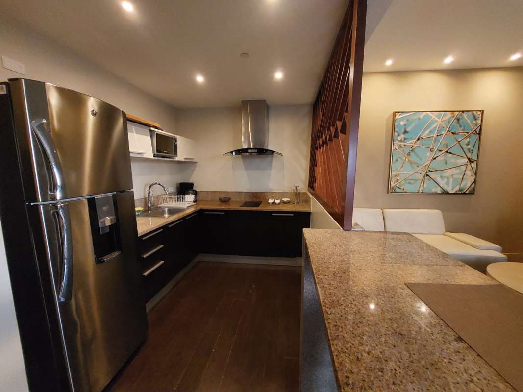 Bedroom with king bed, panoramic windows, city skyline view