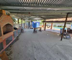 Rustic covered BBQ area gazebo by pool in vacation complex in Chame Panama for sale