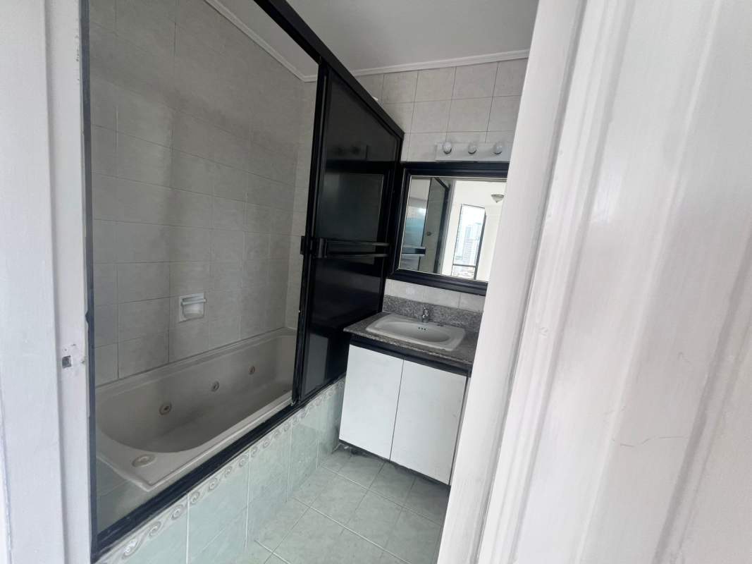 Spacious bathroom with jetted tub, glass enclosure, marble in Panama City
