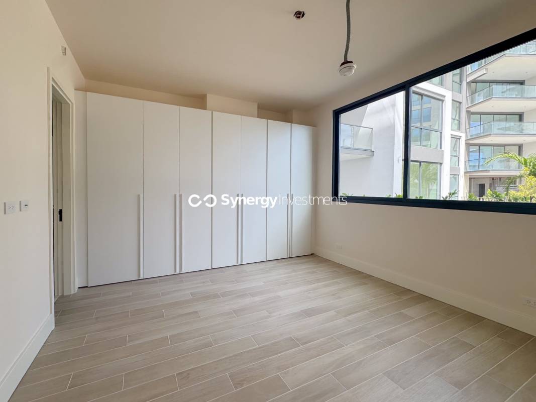 Guest bedroom with marble floor and large window PH Ocean Reef Islands Panama