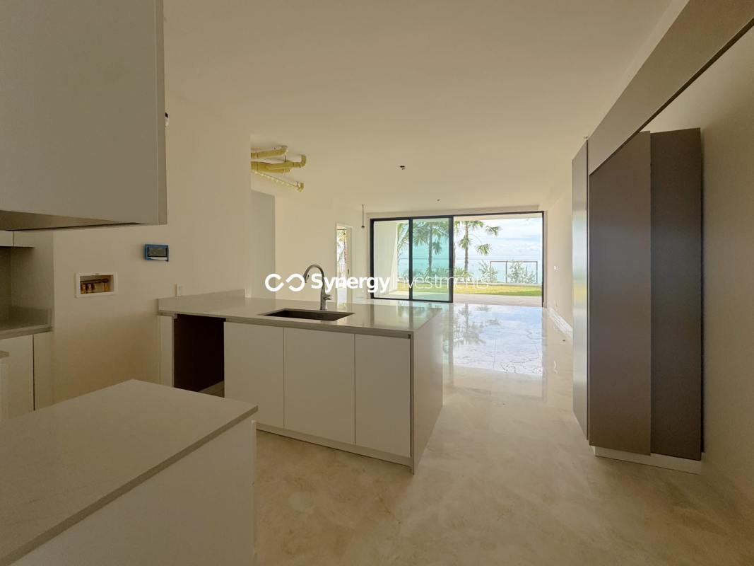 Master bedroom with marble floors and sliding glass door to garden in Punta Pacífica Panama