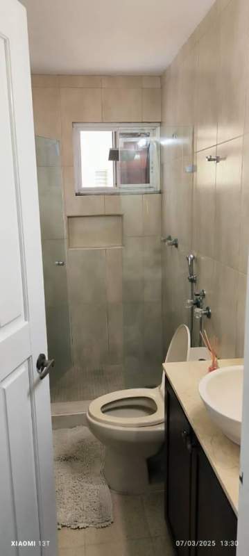 Tile bathroom with walk-in glass shower and vessel sink El Cangrejo PH Del Rey Panama