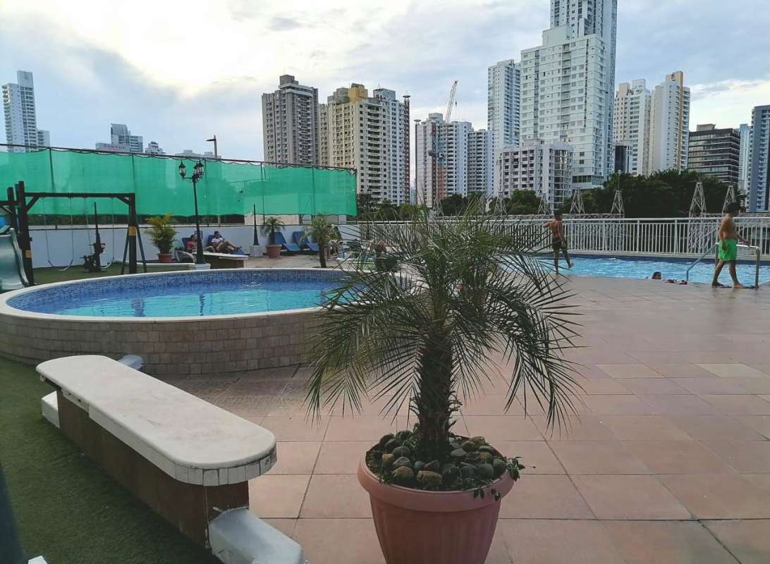 Rooftop infinity swimming pool overlooking city skyline PH Sky Residence San Francisco Panama
