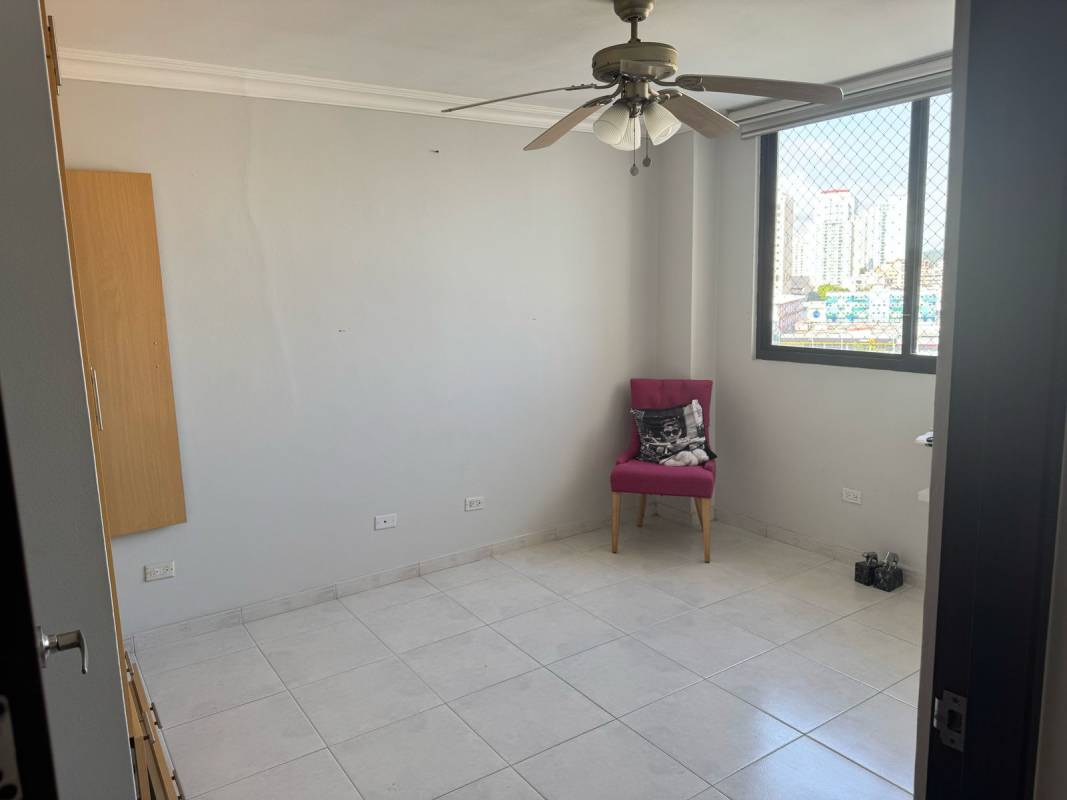Bedroom featuring canopy bed, large window and ceiling fan in PH La Fontana Panama City