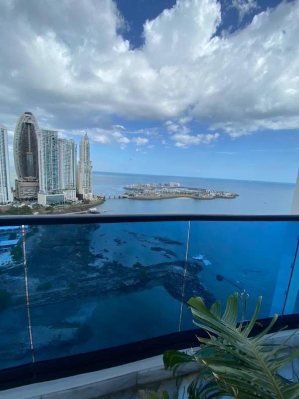 High-rise balcony overlooking Pacific Ocean, city skyline, and coastal islands from PH Ocean Front Paitilla