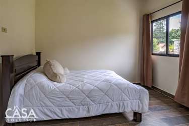 Bedroom with large window, natural light and mountain view in Boquete Panama home for sale