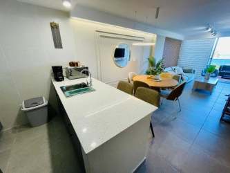 Modern bedroom with large window facing Ocean at PH The Palms El Palmar San Carlos Panama