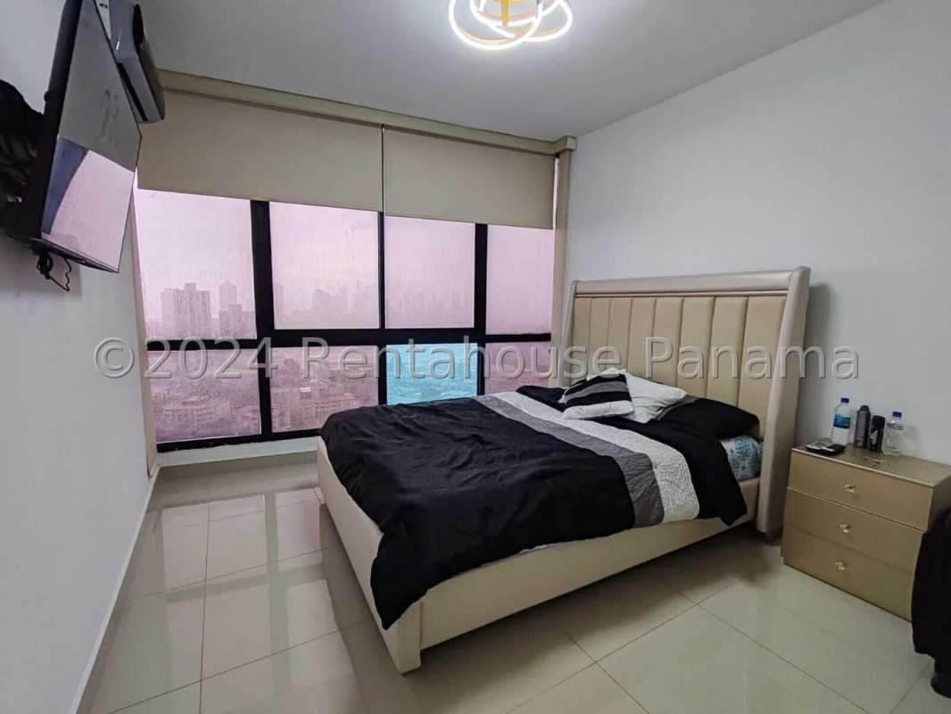 Bright open living room with panoramic windows and skyline view in PH Quattro Parque Lefevre Panama