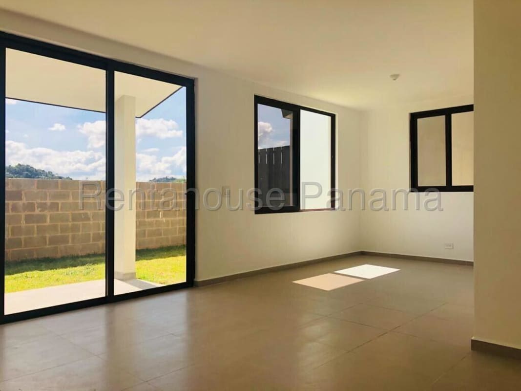 Living room with sliding glass doors to patio Golf Gardens Brisas del Golf Panama