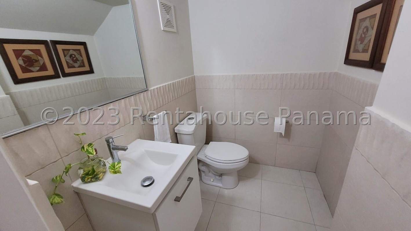 Bright living room with tile floors, sofas, large windows in Quintas de Versalles Panama City