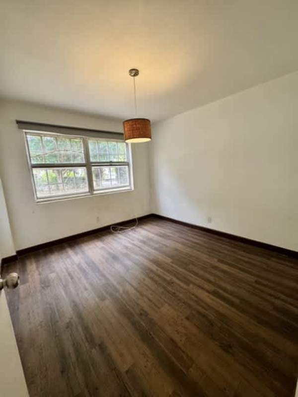 Modern renovated bathroom in Clayton rental apartment with walk-in tiled shower
