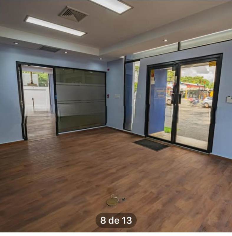 Gated driveway with parking in front of arched window facade Panama City Costa del Este