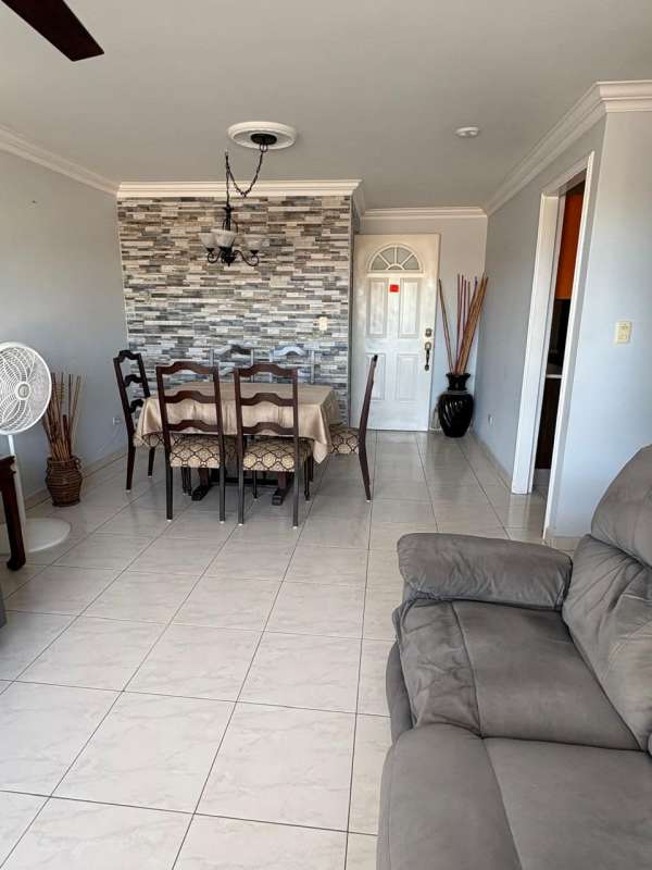 Bright living room panoramic window sofas AC PH McGregor Hill Condado del Rey Panama