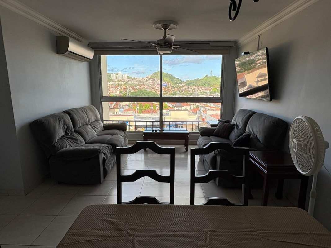 Modern kitchen orange cabinetry gas stove microwave PH McGregor Hill Panama