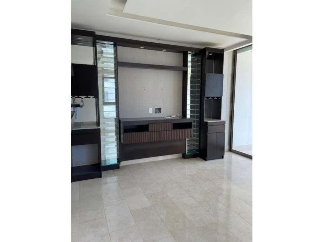 Modern living area with custom wood bar and shelving at Greenview Residences Santa María Panama