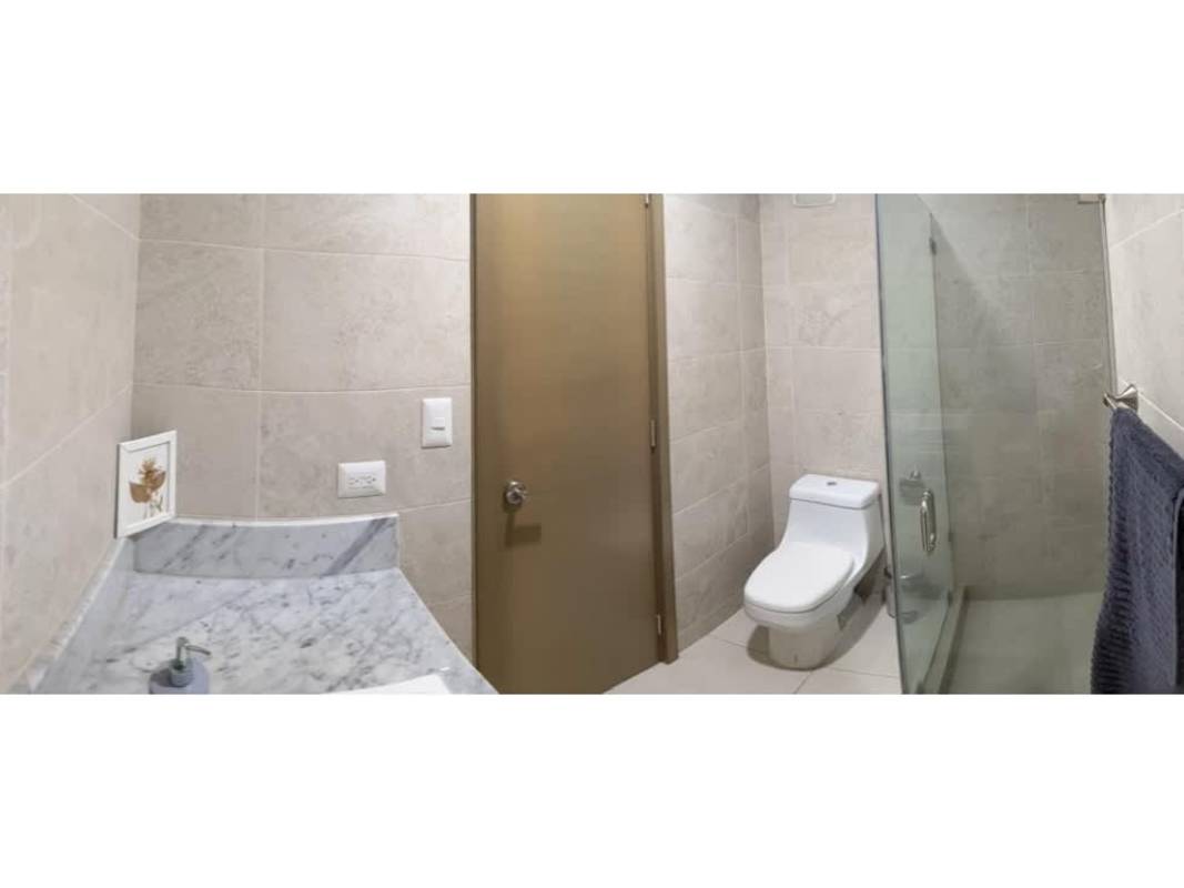 Bedroom with floor-to-ceiling windows and skyline view at PH Park City Obarrio Panama