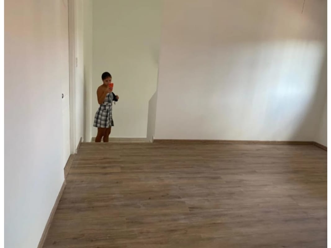 Large den living space with floating wooden floors in Lyon Model Versalles I Panama