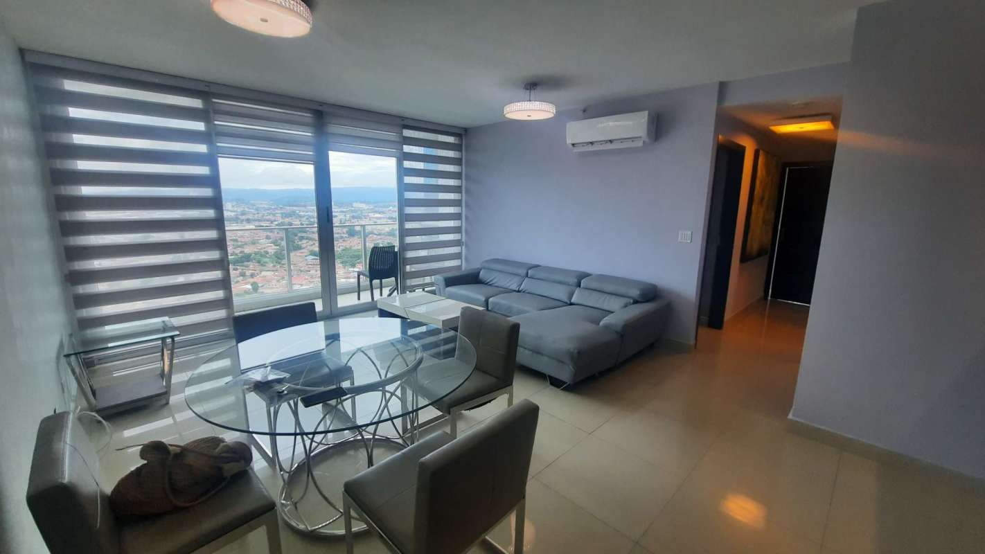 Living dining area with panoramic windows city view Costa del Este PH Costa del Mar