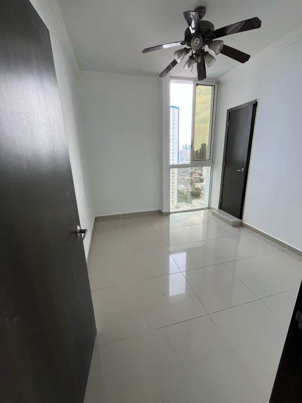 Bright living room features panoramic floor-to-ceiling windows overlooking Panama City PH Quadrat