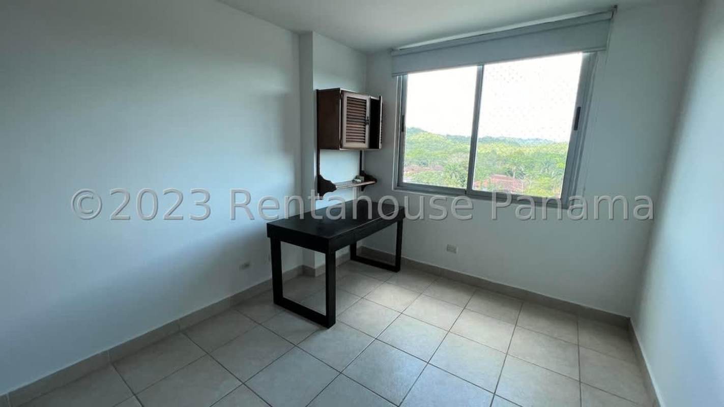 Outdoor swimming pool area with lounge chairs, playground, surrounded by trees PH Albrook Parkside