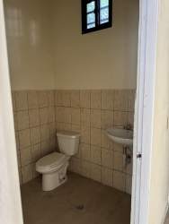 Simple commercial bathroom interior inside retail unit Bugaba David Chiriquí