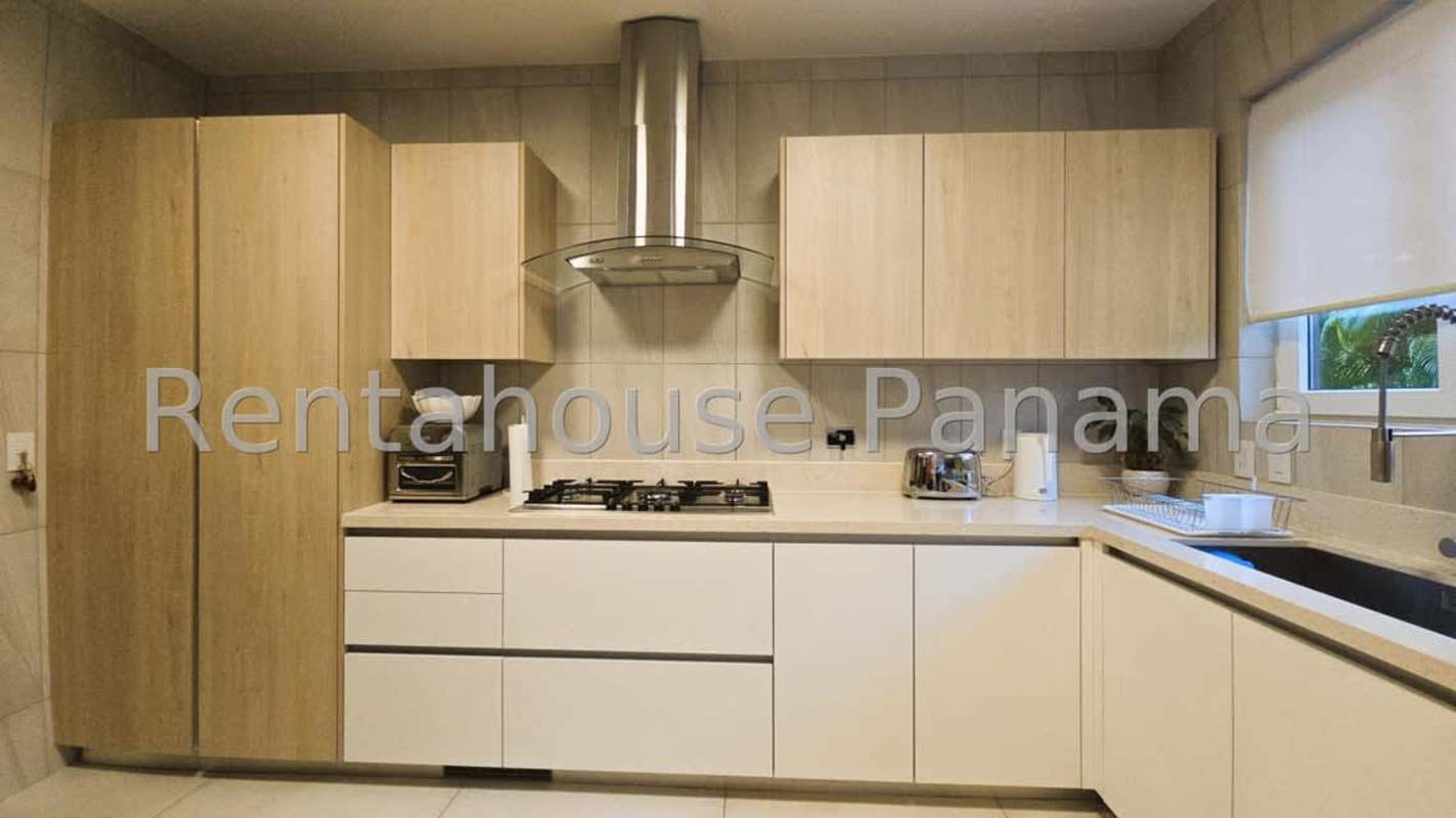 Kitchen in Santa Maria home with light cabinetry, gas cooktop and modern appliances Panama City