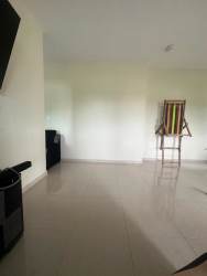 Minimalist bedroom with checkered chest in Las Brisas de David rented house Panama