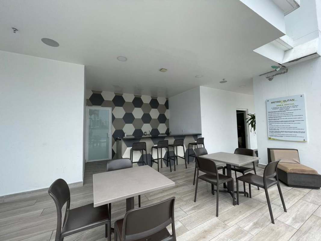 Private balcony with glass railings overlooking Panama City skyline, PH Carrasquilla