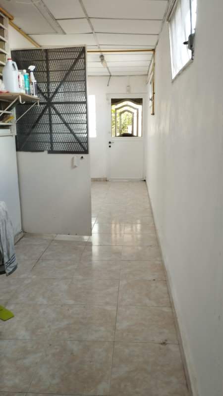 Bright bedroom with tile floor and large window in duplex Club X Betania Panama