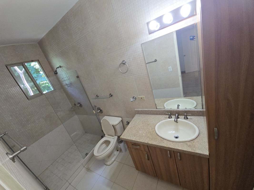 Spacious kitchen with wood cabinets and granite counters Embassy Gardens Panama